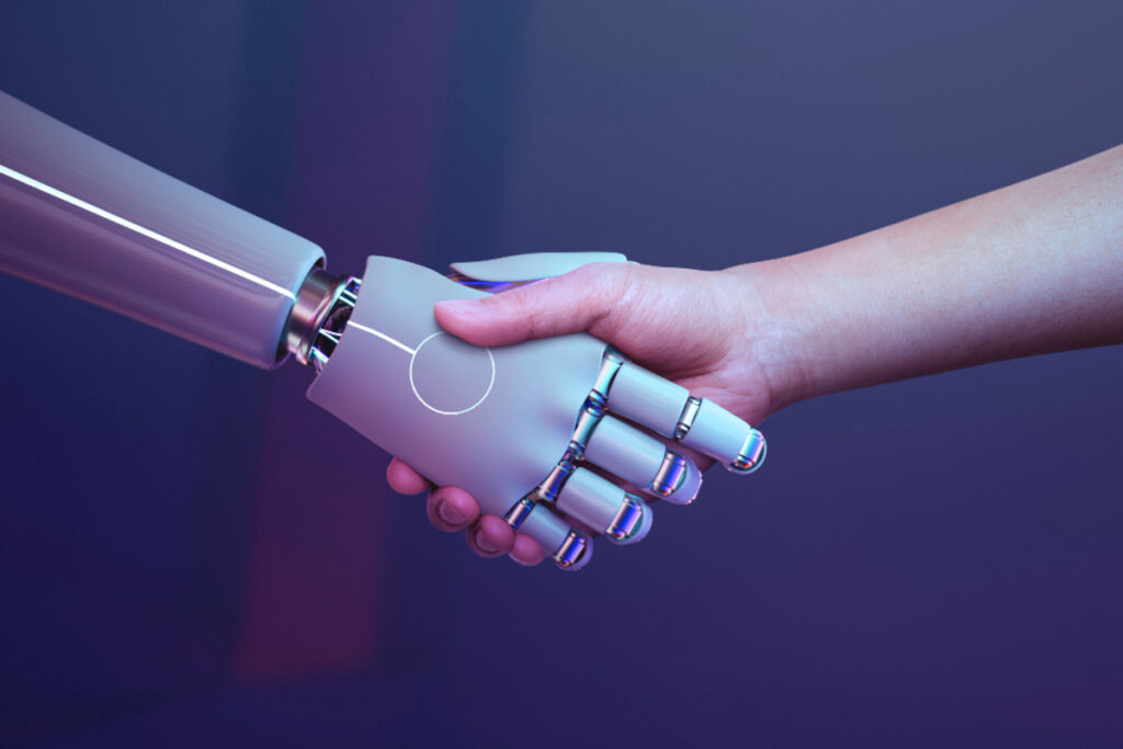 Aperto de mãos humano e robô.