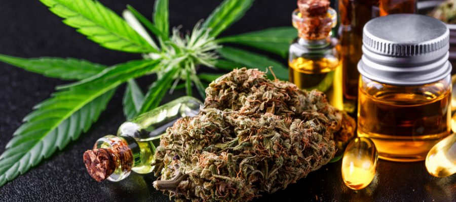 Medical marijuana flower buds. Recreational marijuana strain. Cannabis strain. Weed bud in the glass jar. Dispensary menu. Hemp buds.isolated on black - medical marijuana concept