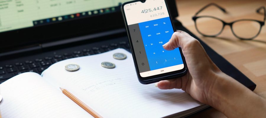 A closeup shot of an entrepreneur working from home on his personal finances and savings